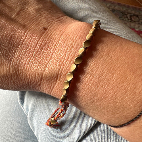 Customer wearing a Hakuna Matata bracelet